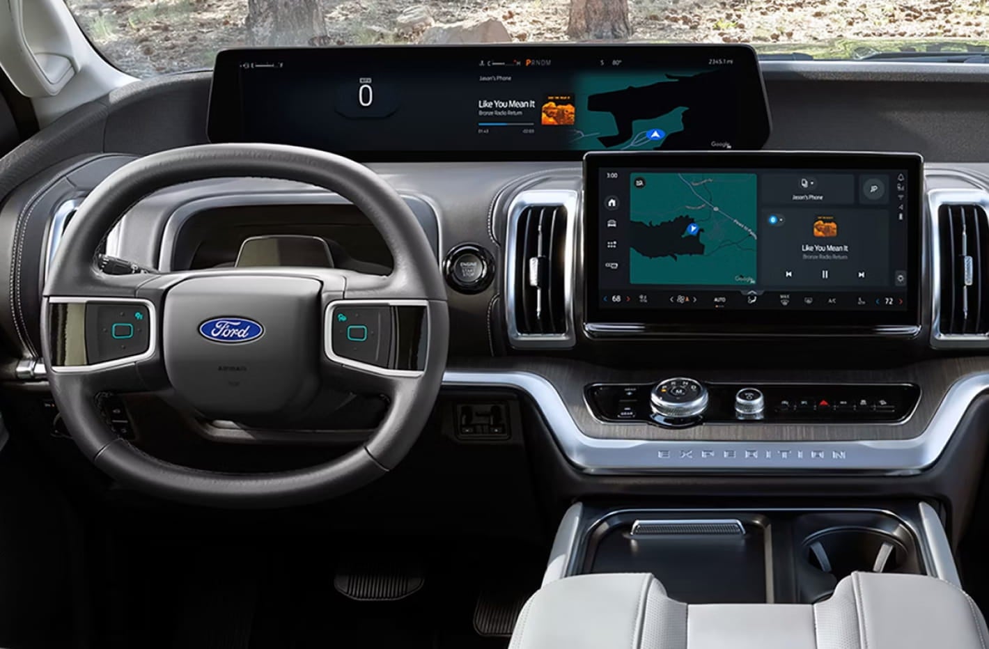 Driver-focused view of the Ford Expedition interior featuring a digital instrument display, large center touchscreen with navigation and media controls, multifunction steering wheel, and center console.